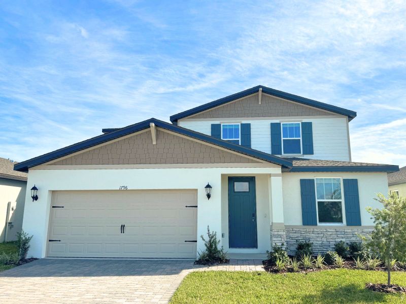 Front exterior of a new home in Two Rivers - Classic Series, Zephyrhills, FL, highlighting curb appeal (Image 1). Front exterior of a new home in Two Rivers - Classic Series, Zephyrhills, FL, highlighting curb appeal (Image 1).