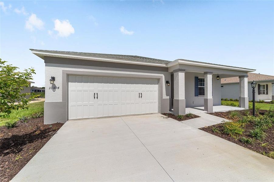 Front exterior of a new home in , Ocala, FL, highlighting curb appeal (Image 21). Front exterior of a new home in , Ocala, FL, highlighting curb appeal (Image 21).