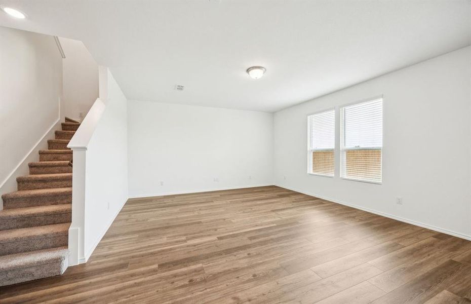 *floorplan representation, not actual home - Spacious gathering room with large windows