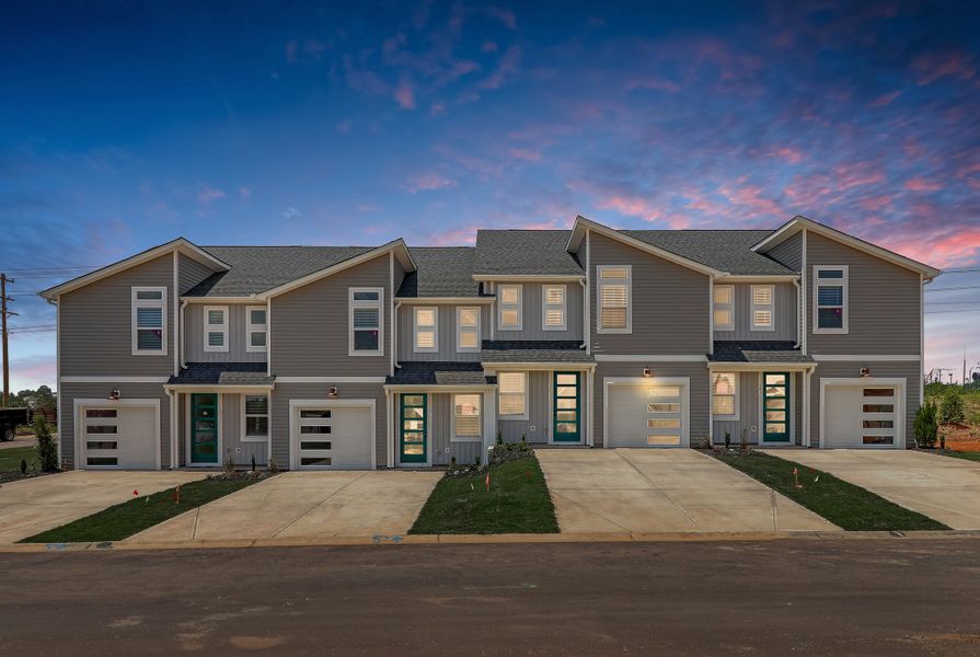 Front exterior of a new home in Westgate Village Townes, Spartanburg, SC, highlighting curb appeal (Image 2). Front exterior of a new home in Westgate Village Townes, Spartanburg, SC, highlighting curb appeal (Image 2).