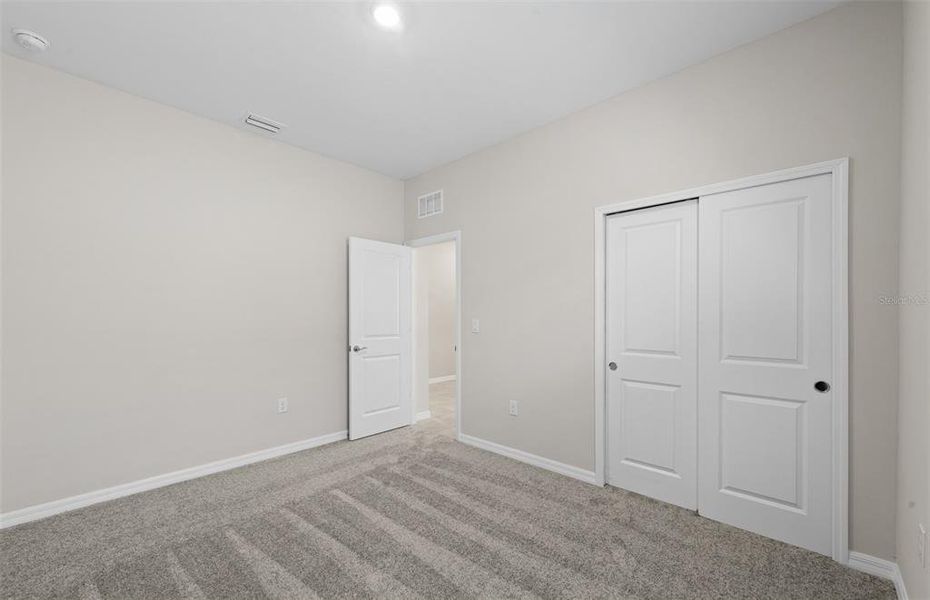 Spacious, unfurnished interior of a new home in The Strand at Cedar Grove, North Port (Image 18).