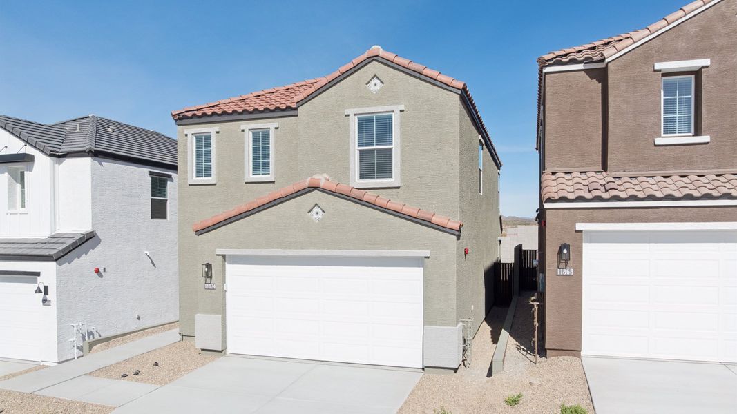 Front exterior of a new home in The Buttes at Mystic, Peoria, AZ, highlighting curb appeal (Image 24).