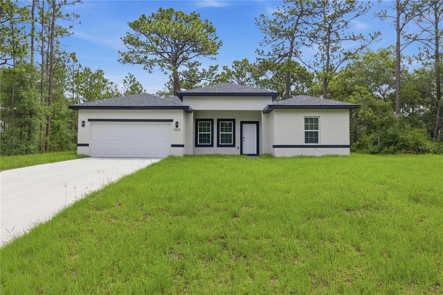 Front exterior of a new home in , Citrus Springs, FL, highlighting curb appeal (Image 1). Front exterior of a new home in , Citrus Springs, FL, highlighting curb appeal (Image 1).