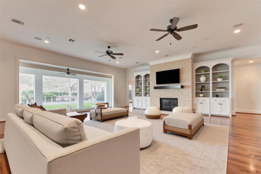 VIRTUALLY STAGED DECOR PHOTO - LIVING ROOM WITH GAS FIREPLACE, BEAUTIFUL BUILT-INS, PICTURE WINDOWS