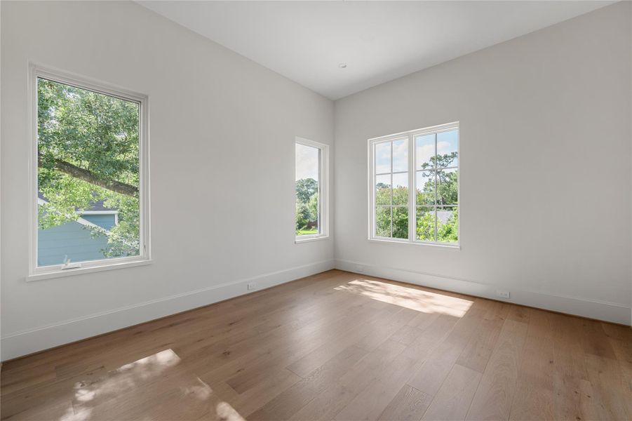 Amazing natural light in this secondary upstairs bedroom.