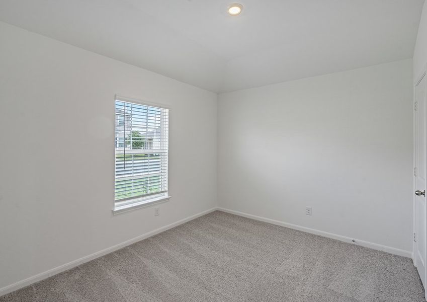 Bedroom with lush carpet flooring