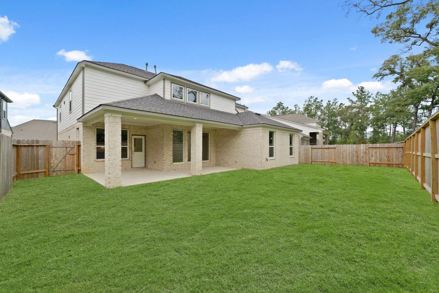 Front exterior of a new home in Barton Creek Ranch, Conroe, TX, highlighting curb appeal (Image 13). Front exterior of a new home in Barton Creek Ranch, Conroe, TX, highlighting curb appeal (Image 13).