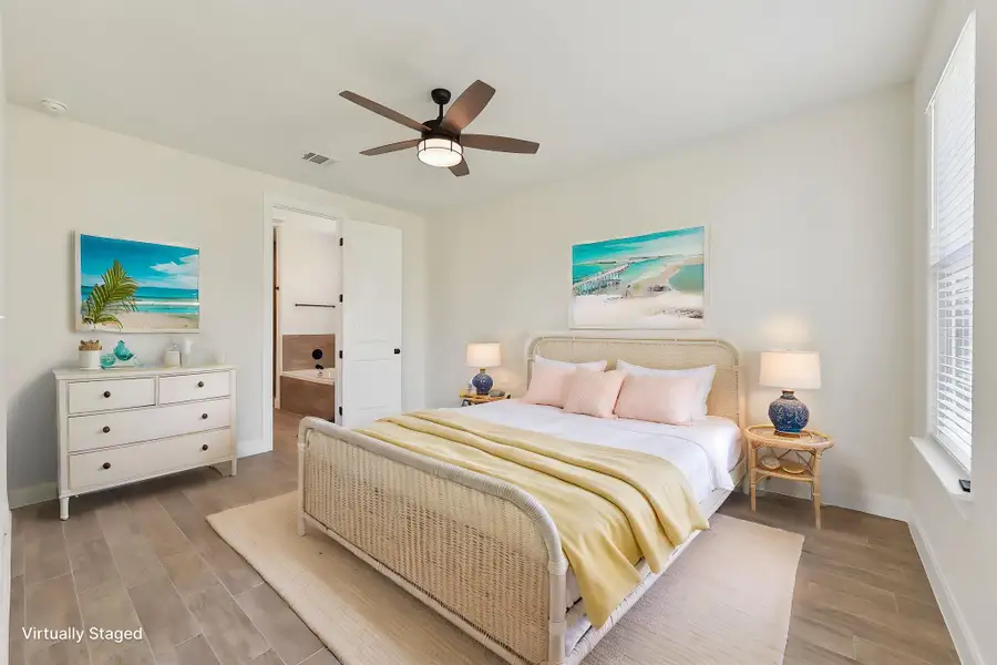 Virtually Staged Primary Bedroom with visible vents, baseboards, ceiling fan, and light wood finished floors Virtually Staged Primary Bedroom with visible vents, baseboards, ceiling fan, and light wood finished floors