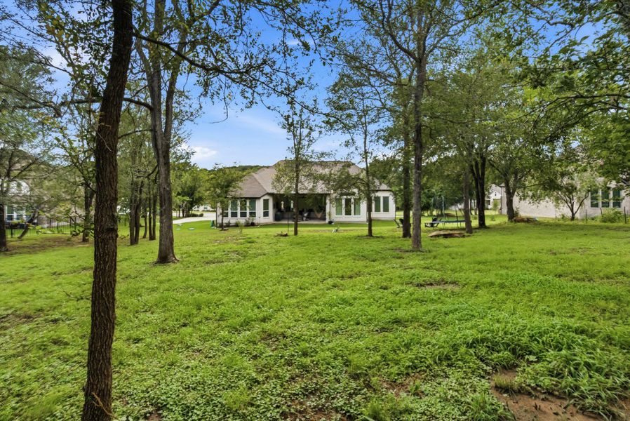 Looking back toward the home, you can truly appreciate the scale of this quiet lot, offering a peaceful, slow-paced lifestyle that is becoming harder to find