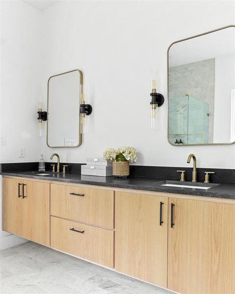 Bathroom with vanity and a shower