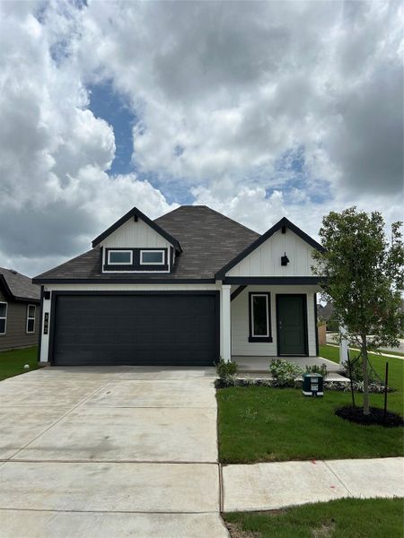 Front exterior of a new home in Cornerstone, Rockdale, TX, highlighting curb appeal (Image 1). Front exterior of a new home in Cornerstone, Rockdale, TX, highlighting curb appeal (Image 1).