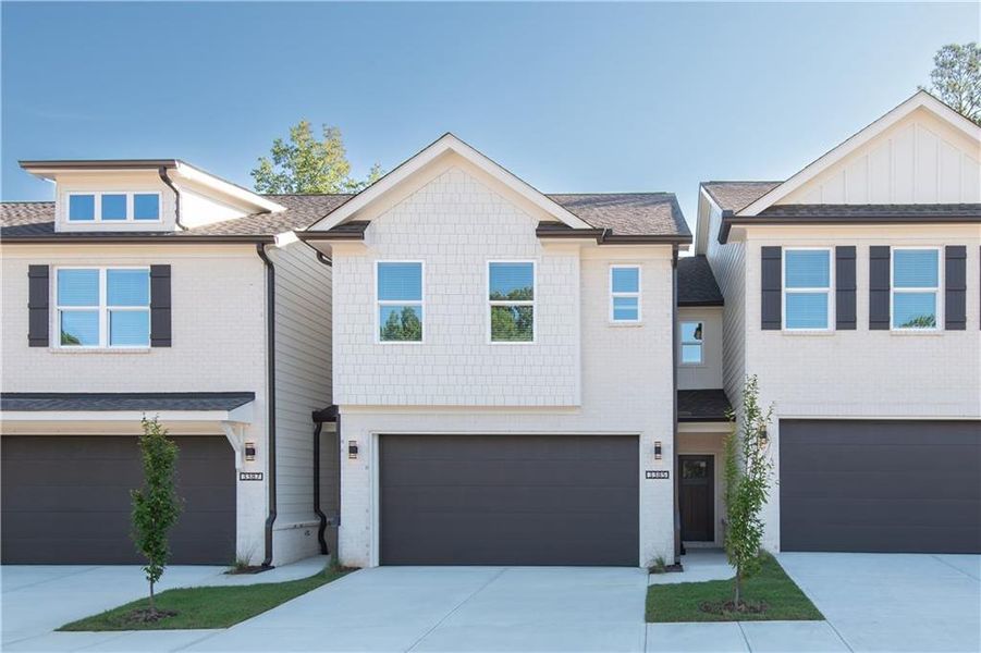 Front exterior of a new home in , Snellville, GA, highlighting curb appeal (Image 1).