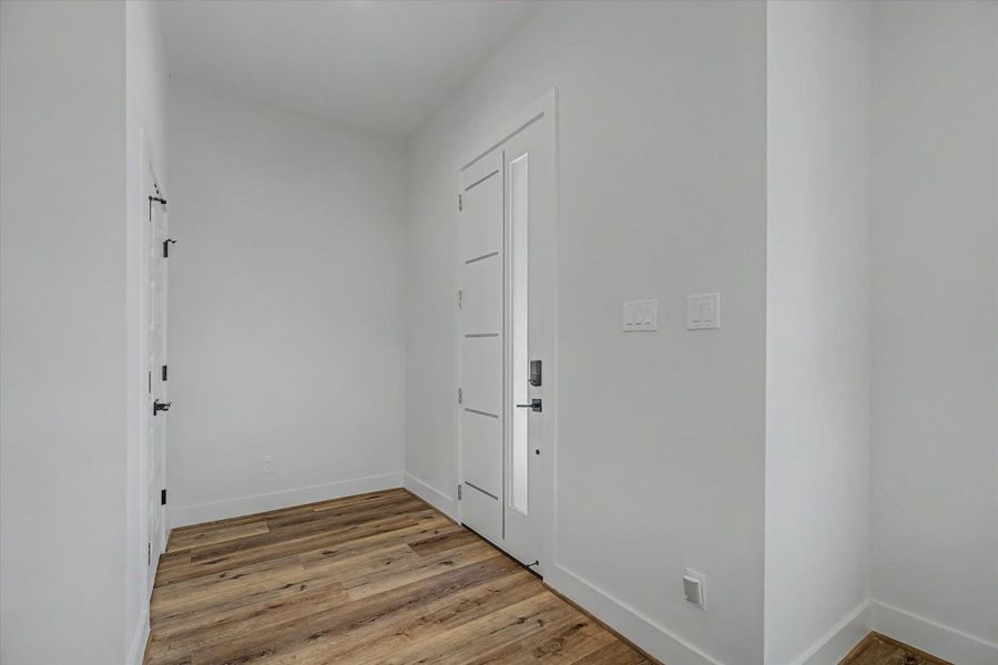 Inviting entry foyer featuring a large coat closet.
