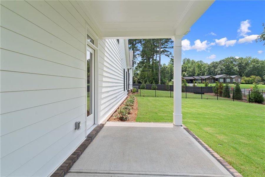 Exterior details and patio area of a home in Promenade at Sawnee Village, Cumming (Image 29).