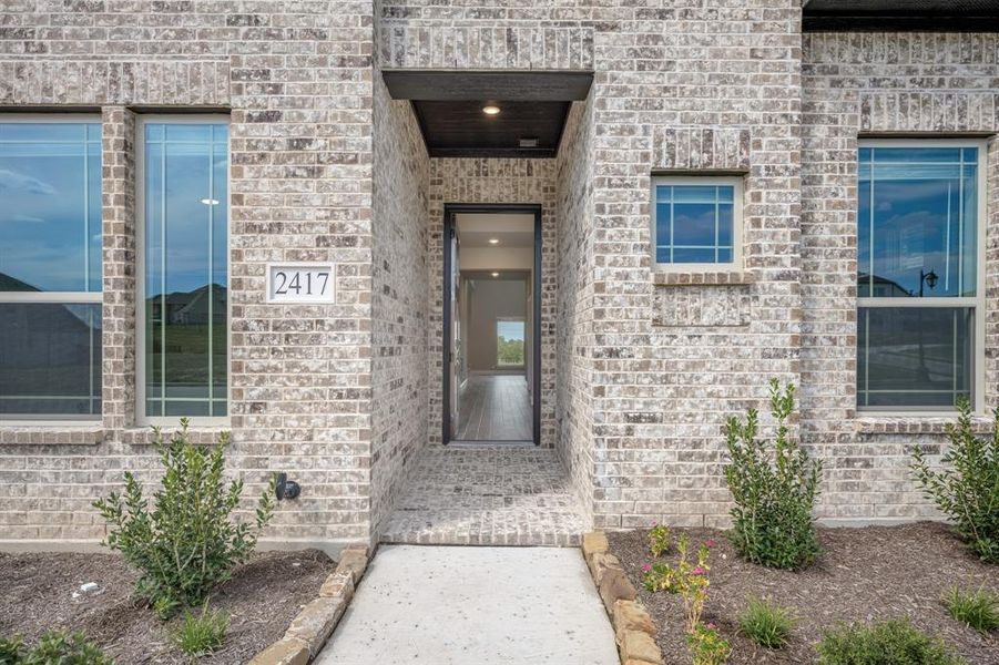 Exterior details and patio area of a home in Devonshire Classic 60-65, Forney (Image 26).