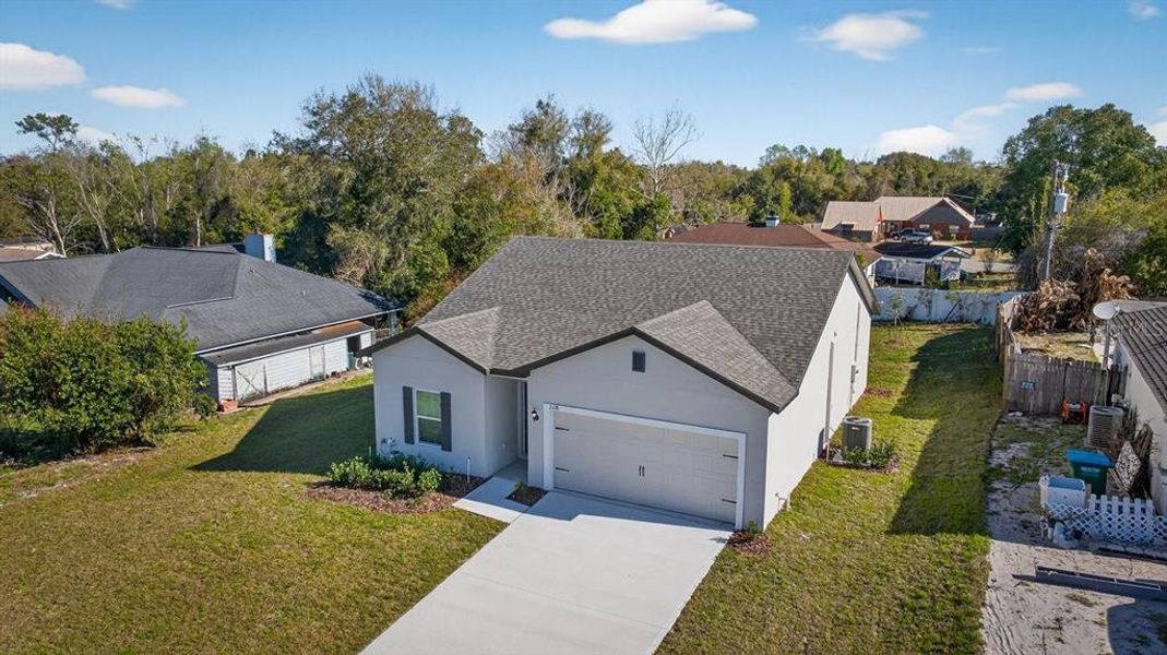 Front exterior of a new home in , Deltona, FL, highlighting curb appeal (Image 1). Front exterior of a new home in , Deltona, FL, highlighting curb appeal (Image 1).