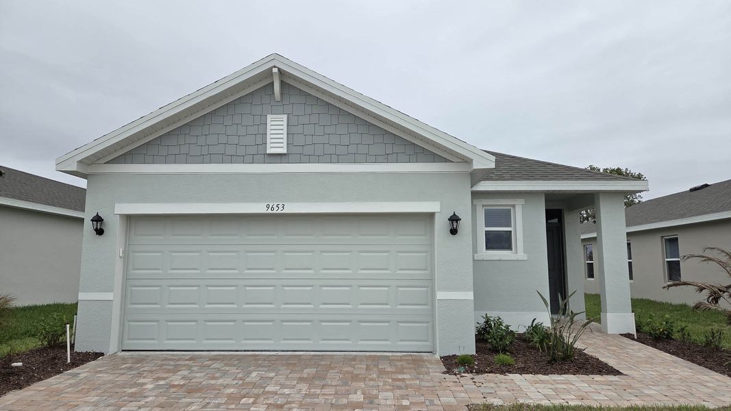Front exterior of a new home in Venetian Grove, Vero Beach, FL, highlighting curb appeal (Image 1). Front exterior of a new home in Venetian Grove, Vero Beach, FL, highlighting curb appeal (Image 1).