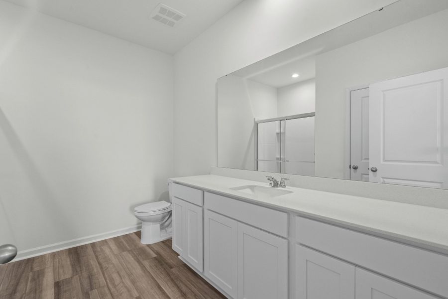 Representative furnished interior of a home built from the Europa by Starlight Homes in Oakfield Lakes, Parrish (Image 9).
