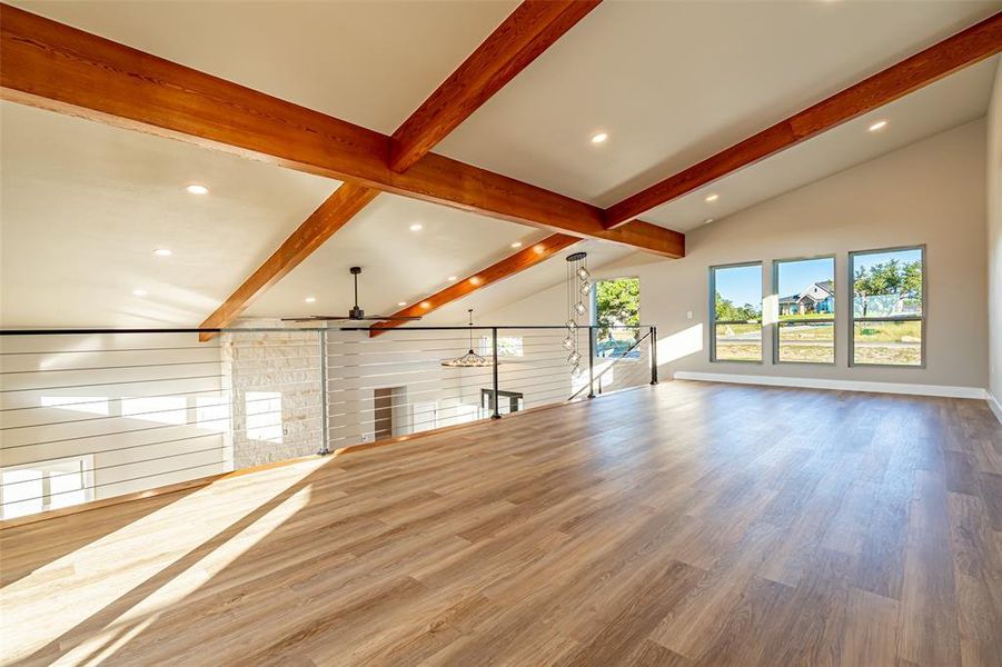 Unfurnished living room with wood finished floors, recessed lighting, and ceiling fan Unfurnished living room with wood finished floors, recessed lighting, and ceiling fan