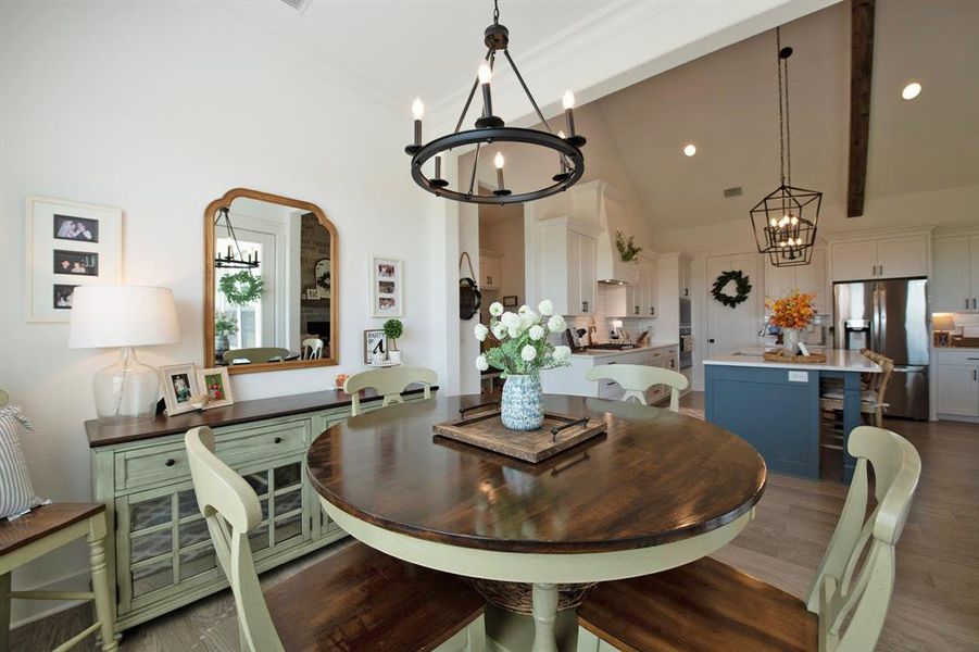 Dining room featuring a chandelier, dark wood-type flooring, and recessed lighting