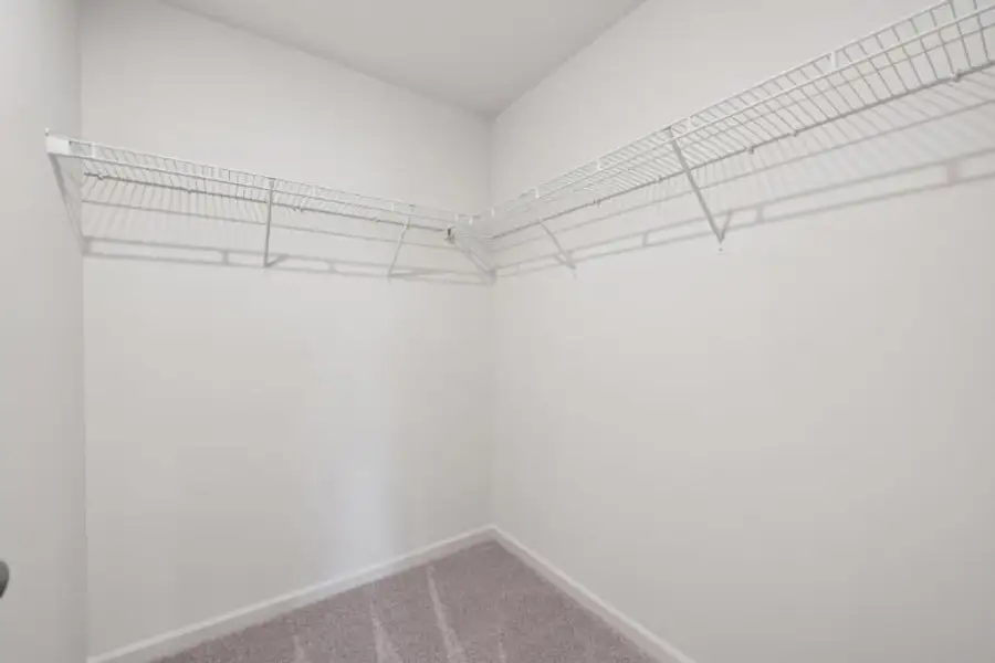 A white room with a tile floor.