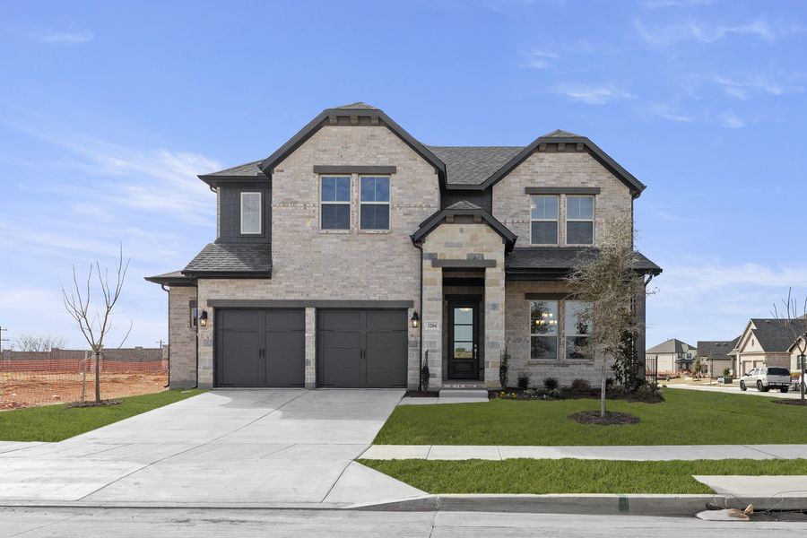 Front exterior of a new home in Brookshire at Legacy Hills, Celina, TX, highlighting curb appeal (Image 2). Front exterior of a new home in Brookshire at Legacy Hills, Celina, TX, highlighting curb appeal (Image 2).