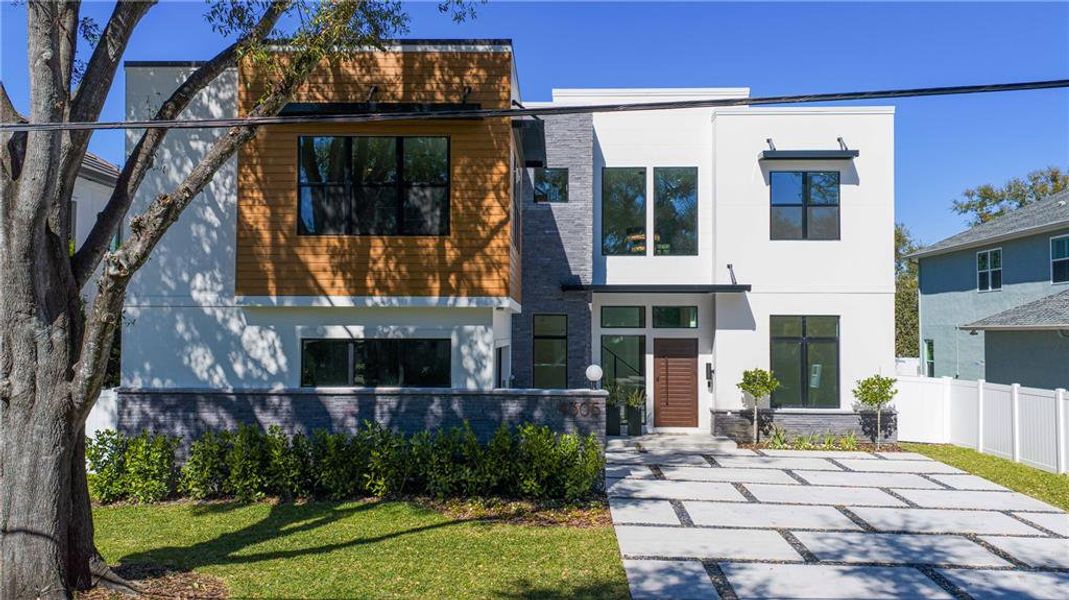 Front exterior of a new home in , Tampa, FL, highlighting curb appeal (Image 29).