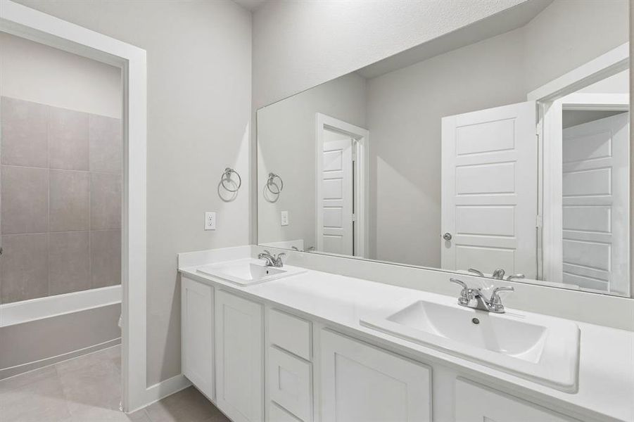 Bathroom in the Winters home plan by Trophy Signature Homes – REPRESENTATIVE PHOTO