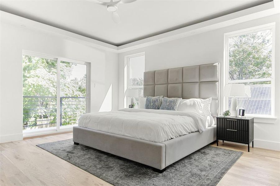 Bedroom with hardwood / wood-style flooring and ceiling fan