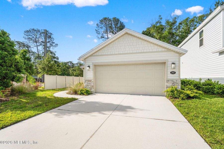 Front exterior of a new home in Pinewood Place, Middleburg, FL, highlighting curb appeal (Image 1). Front exterior of a new home in Pinewood Place, Middleburg, FL, highlighting curb appeal (Image 1).