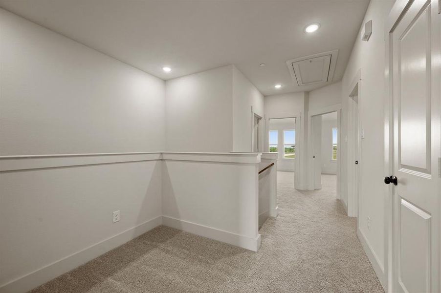 The loft at the top of the stairs makes a perfect pocket office or reading nook.