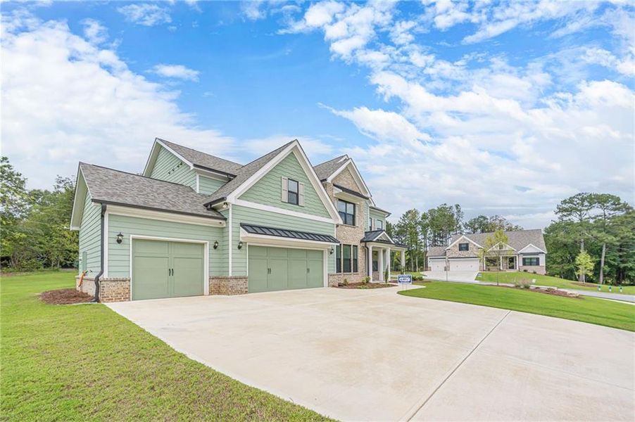 Front exterior of a new home in , Loganville, GA, highlighting curb appeal (Image 27).
