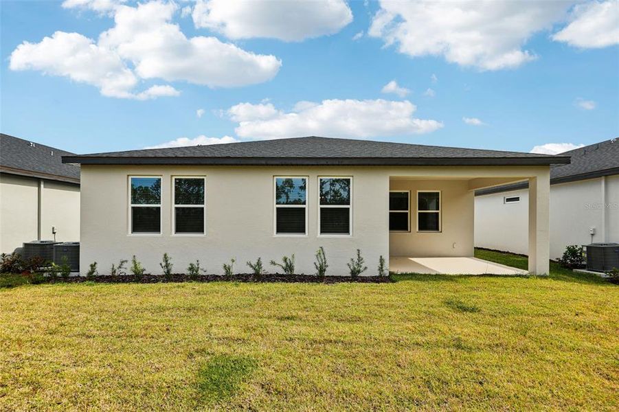 Exterior details and patio area of a home in Ridgehaven - Signature Series, Ormond Beach (Image 24).