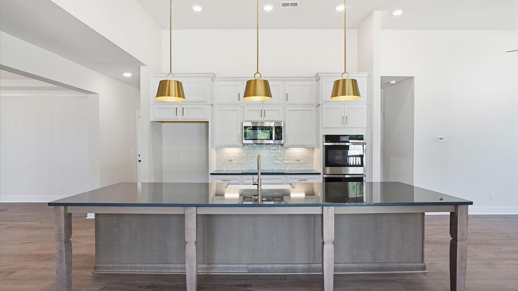 Well-designed kitchen with a center island and tasteful finishes that elevate everyday living at the Pinebrook community Well-designed kitchen with a center island and tasteful finishes that elevate everyday living at the Pinebrook community