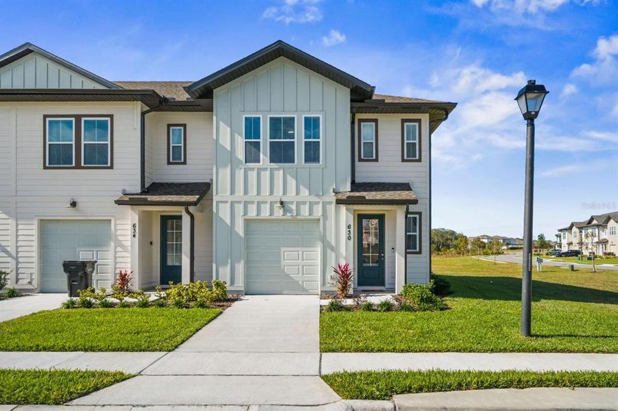 Front exterior of a new home in , Davenport, FL, highlighting curb appeal (Image 1). Front exterior of a new home in , Davenport, FL, highlighting curb appeal (Image 1).