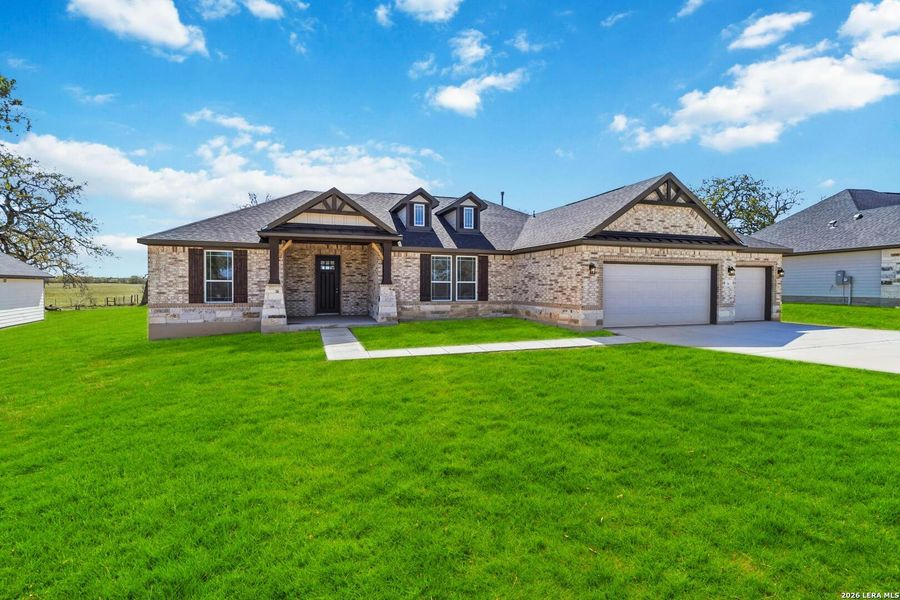 Front exterior of a new home in Lonesome Dove, San Antonio, TX, highlighting curb appeal (Image 20).