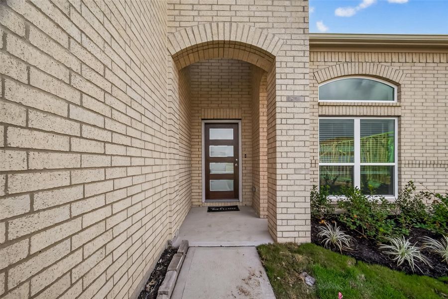 Exterior details and patio area of a home in Rates starting as low as, Iowa Colony (Image 3).