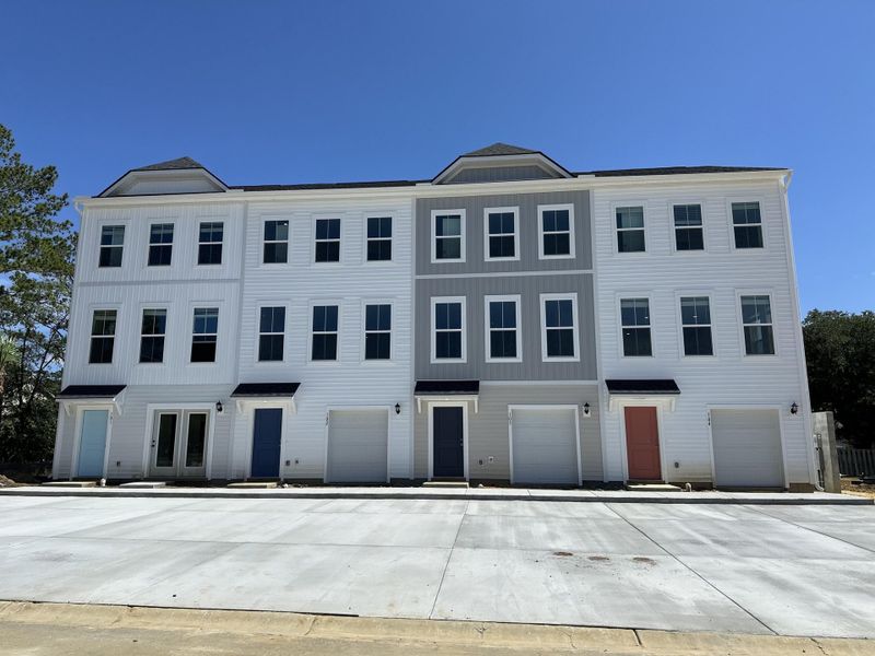 Front exterior of a new home in Clear Springs Townhomes, North Charleston, SC, highlighting curb appeal (Image 1).