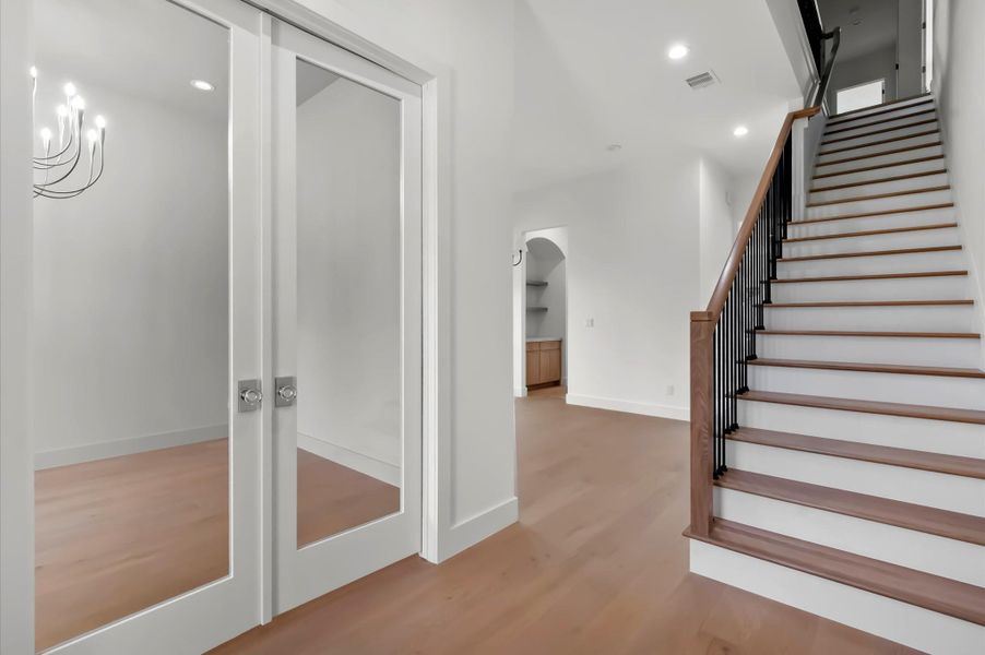Welcoming foyer with staircase access. Welcoming foyer with staircase access.