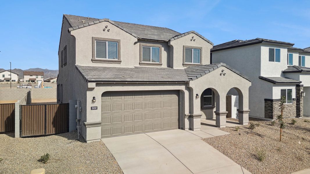 Front exterior of a new home in Apache Farms, Buckeye, AZ, highlighting curb appeal (Image 2).
