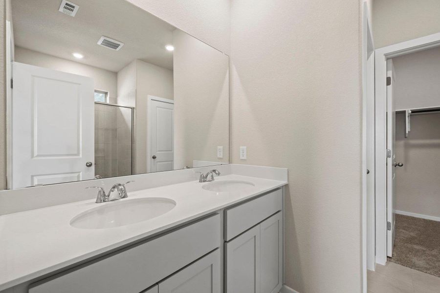 Primary Bath retreat with dual vanities & walk-in shower