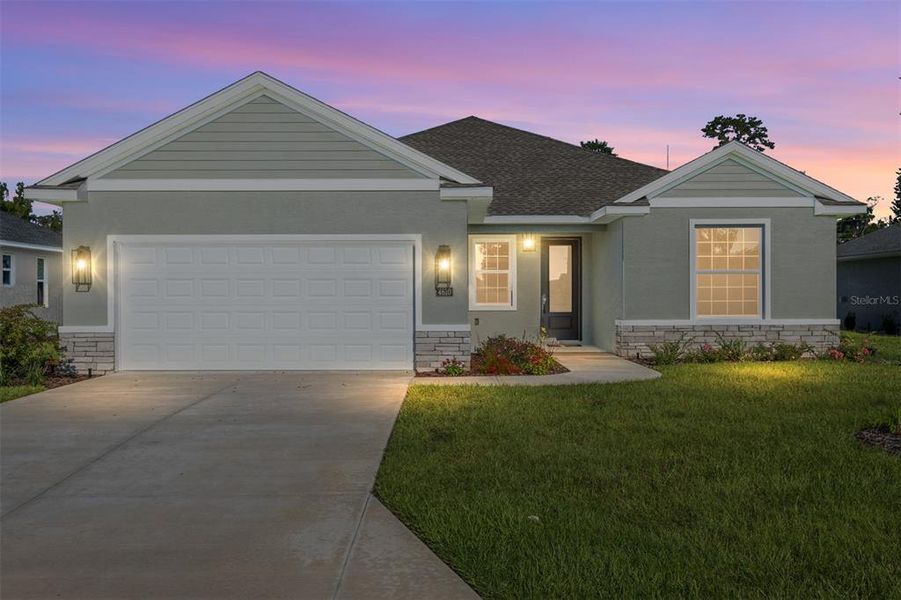 Front exterior of a new home in Evergreen Estates, Ocala, FL, highlighting curb appeal (Image 1).