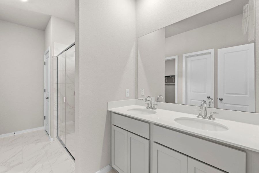 Primary Bath retreat with dual vanities & walk-in shower