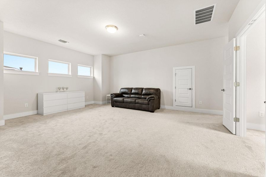 The large game room is the focal point of the second floor.