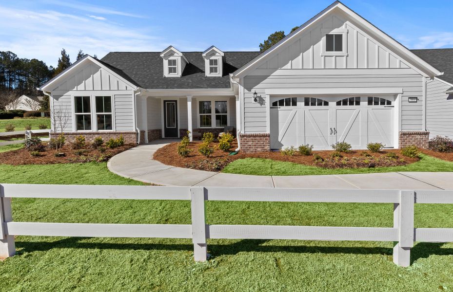 Front exterior of a new home in Sun City Peachtree, Griffin, GA, highlighting curb appeal (Image 26). Front exterior of a new home in Sun City Peachtree, Griffin, GA, highlighting curb appeal (Image 26).