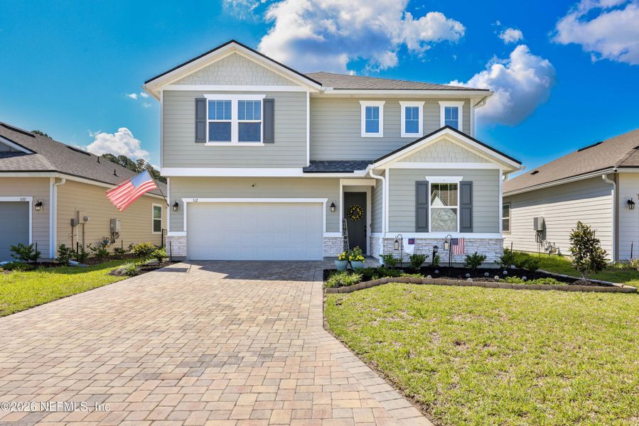 Front exterior of a new home in Elm Creek at Silverleaf, St. Augustine, FL, highlighting curb appeal (Image 2). Front exterior of a new home in Elm Creek at Silverleaf, St. Augustine, FL, highlighting curb appeal (Image 2).