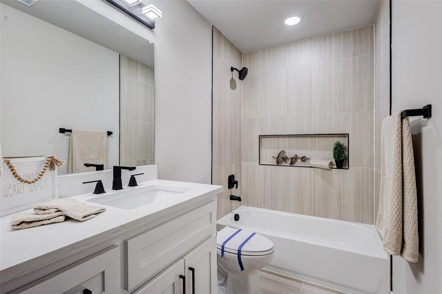 Full bathroom featuring vanity and bathing tub / shower combination
