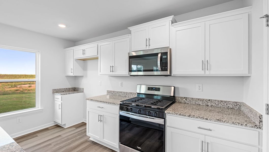 Furnished interior view inside a new home in Bentley Park, Greenwood (Image 10).