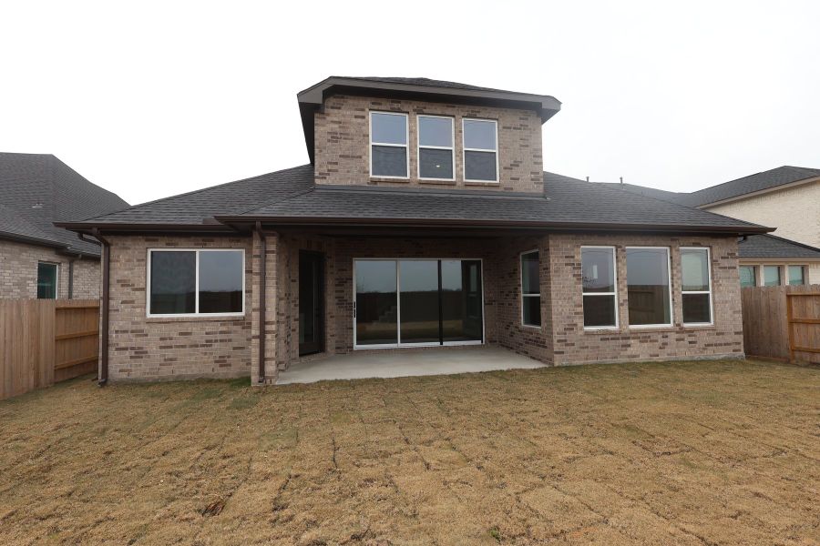 Exterior details and patio area of a home in Brookewater 55’ Homesites, Rosenberg (Image 18).
