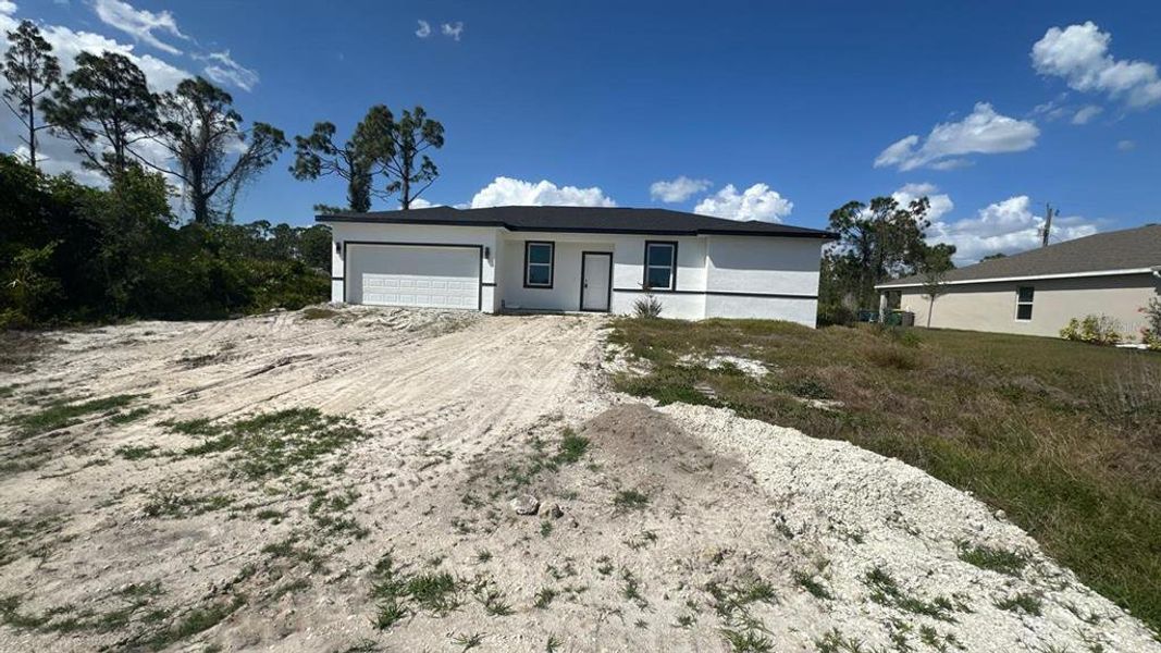 Front exterior of a new home in , Port Charlotte, FL, highlighting curb appeal (Image 19).